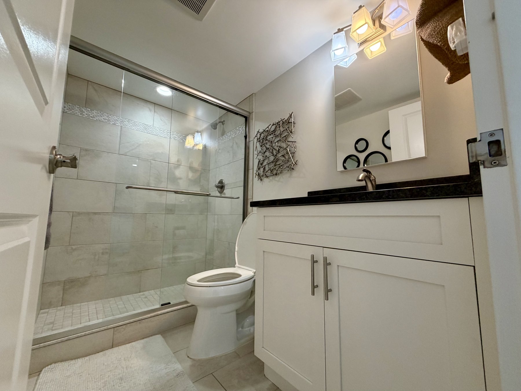 Second bathroom walk-in shower in rental unit 1004
