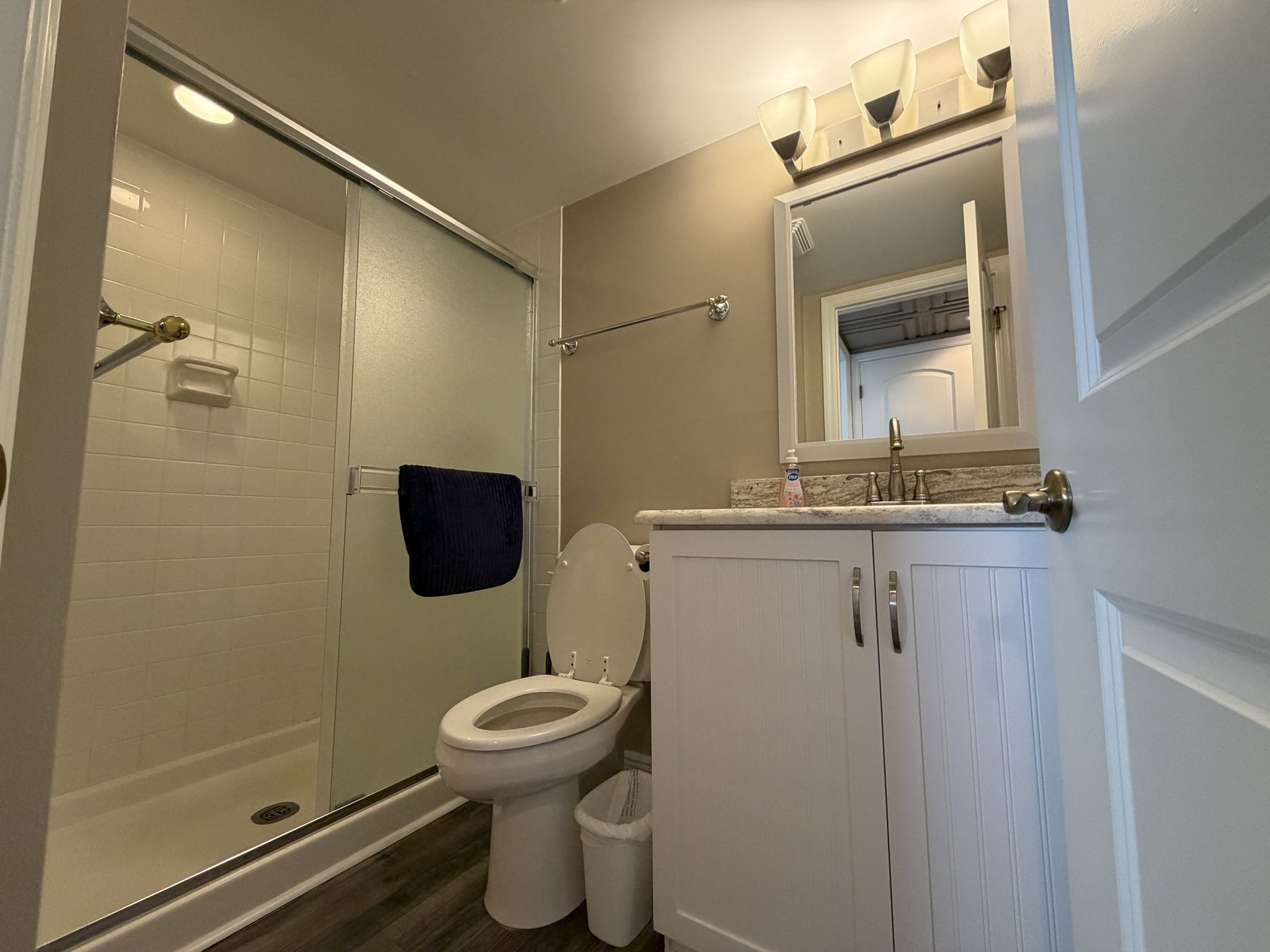 Guest bathroom walk-in shower in rental unit 1005
