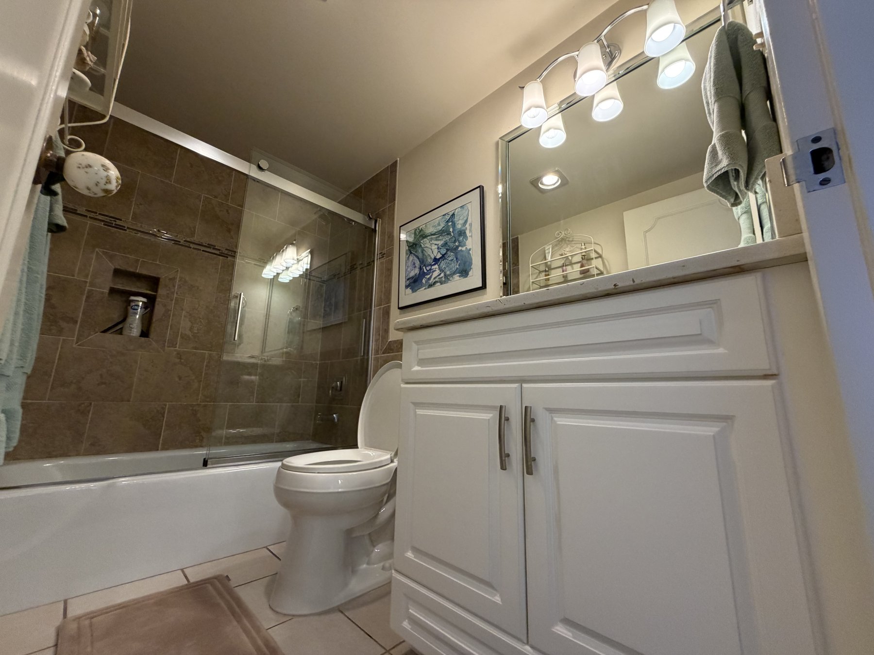 Bathroom with tub and shower in rental unit 305