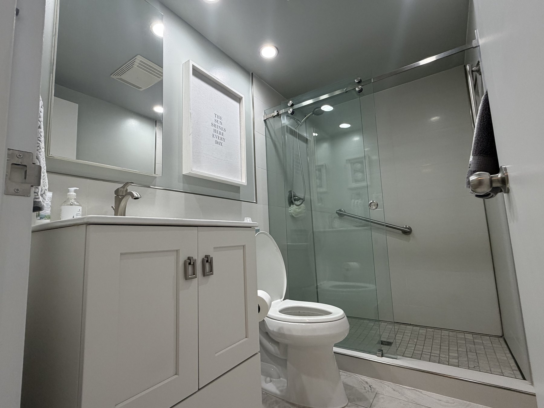 Guest bathroom with walk-in shower in rental unit 601